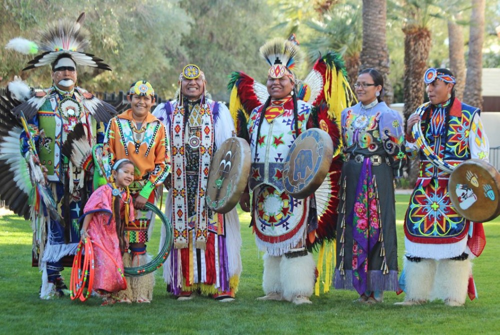 First Nations people wearing traditional clothes